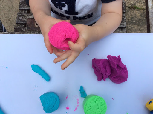 child playing with Play-Doh